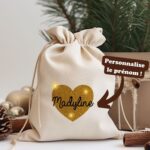 Un emaballage cadeau en coton 100% bio, réutilisable, avec un coeur pailleté et une personnalisation avec un prénom